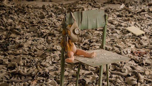 doll with mask on chair thumbnail