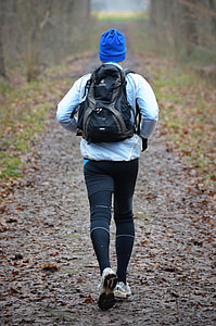 man carrying backpack on dried leaves thumbnail