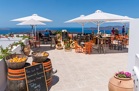 brown and white patio table set the the roof top thumbnail