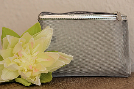 gray mesh pouch and yellow artificial flower thumbnail