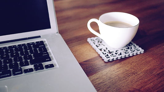 cup of coffee beside MacBook thumbnail