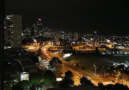 aerial view photography of high rise buildings at nighttime thumbnail