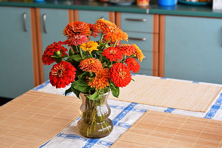 orange flowers in vase thumbnail