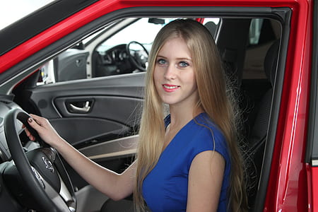 woman sitting inside the vehicle driver's seat thumbnail