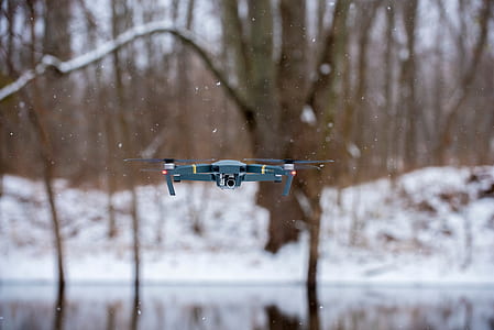 blue quadcopter drone hovering thumbnail