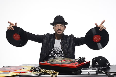 man holding vinyl records thumbnail