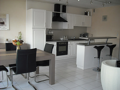 rectangular brown dining table with cantilever chair thumbnail