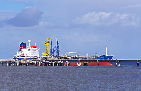 white and blue ship on large body of water during daytime thumbnail