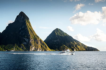 body of water near mountains thumbnail