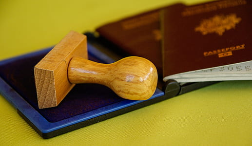 brown stamp beside passports thumbnail