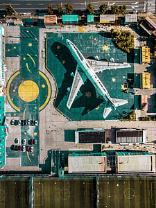 aerial view photography of passenger plane on rooftop thumbnail