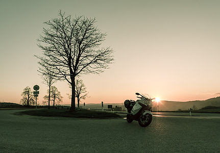 white sports bike during sunrise thumbnail