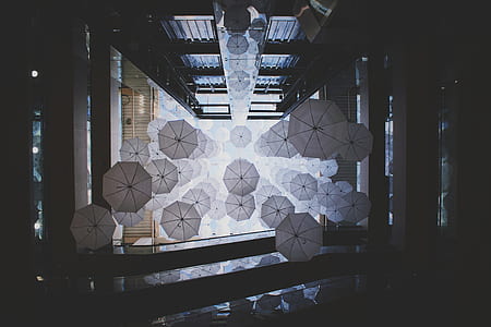 worm's eye view of white umbrellas thumbnail