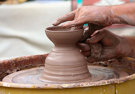 person making clay pot thumbnail