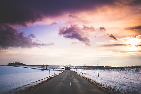 photo of empty pave road during golden hour thumbnail