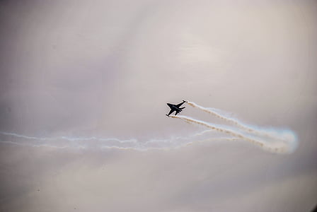 black plane under clouds at daytime thumbnail