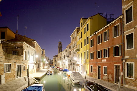 river in the middle of concrete buildings thumbnail