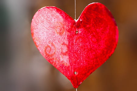 closeup photo or heart-shaped red decor thumbnail