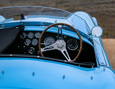 close-up photo of blue convertible coupe at daytime thumbnail
