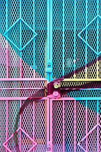 teal, yellow, and pink steel gate thumbnail