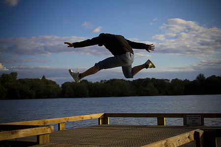 man in black hoodie jumping thumbnail