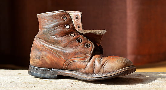 unpaired brown leather boot thumbnail