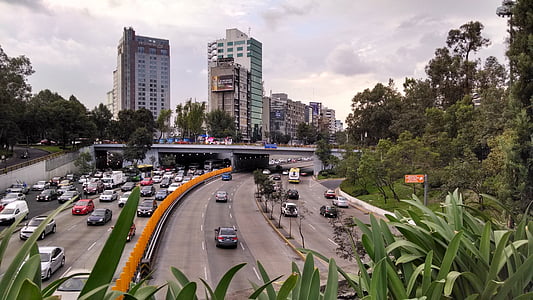 cars running on road during daytime thumbnail