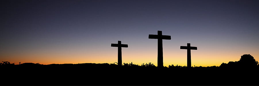 Landscape View of 3 Cross Standing during Sunset thumbnail