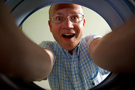 man in blue checkered polo taking selfie thumbnail