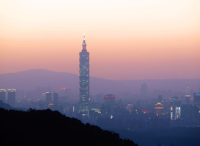 Taipei 101 at dusk under the reddish skies and haze in Taiwan thumbnail