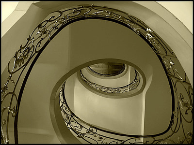 high-angle photography of spiral staircase with railings thumbnail