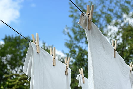 white fabric hanged on clothes line thumbnail