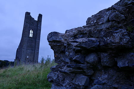 rock formation on green grass field thumbnail