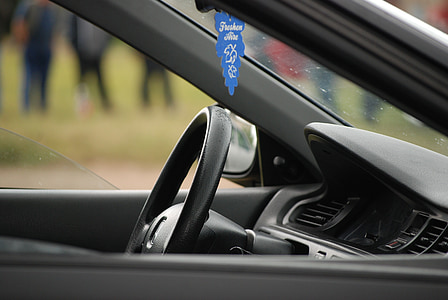 close-up photo of black car steering wheel thumbnail