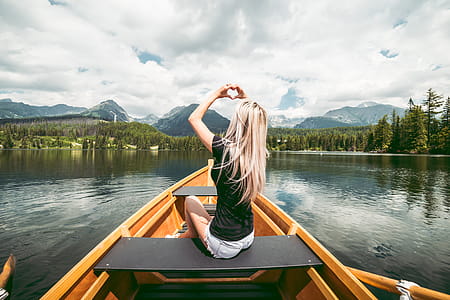Young Woman Showing Heart Symbol with Hands thumbnail