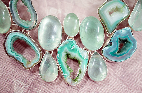 green gem beaded bubble necklace on white textile thumbnail