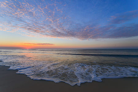 photo of seashore during sunrise thumbnail