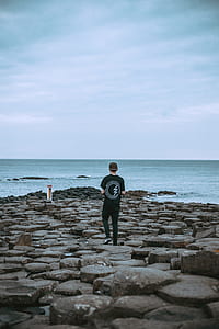 man walking on Giant Causeway thumbnail