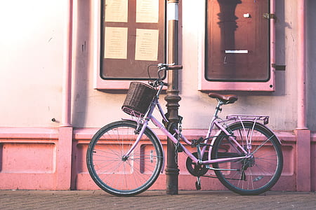 bicycle parked beside post thumbnail