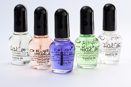 five assorted-color cuticle oil bottles thumbnail
