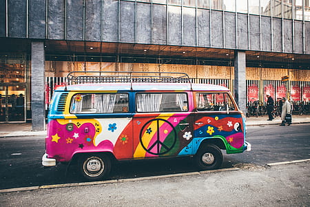 peace design bus passing by buildings thumbnail