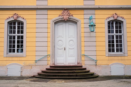 photo of white and yellow building thumbnail