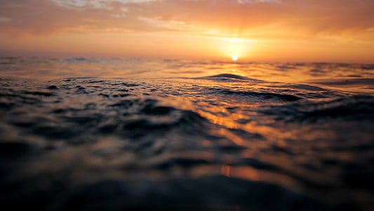 body of water during sunset thumbnail