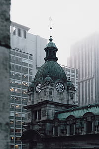 selective focus photography of building with clock thumbnail