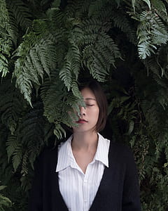 woman surrounded by fern leaves thumbnail
