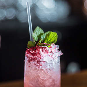 clear glass filled with beverage with mint thumbnail