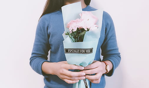 woman holding pink flower bouquet thumbnail