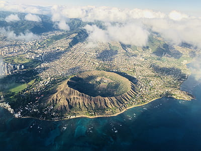 aerial photography of volcano near shore at daytime thumbnail