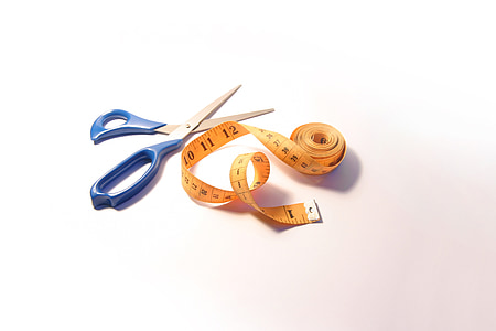 blue shears beside orange tape measure on white surface thumbnail