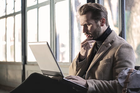 man staring at the screen of laptop computer thumbnail